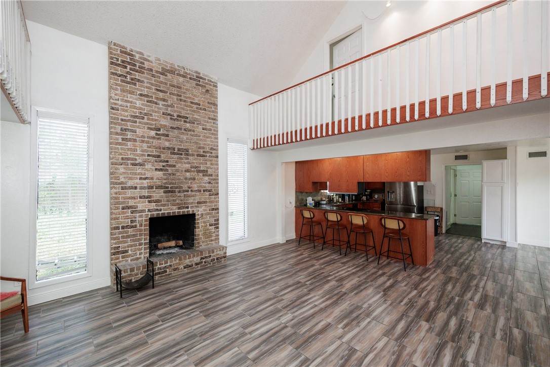 4029 Congressional Drive Corpus Christi, TX 78413 - Photo 3 of 34 a view of living room kitchen with furniture and wooden floor