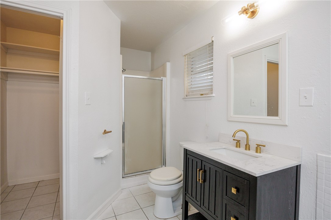 4029 Congressional Drive Corpus Christi, TX 78413 - Photo 33 of 34 a bathroom with a sink toilet and vanity