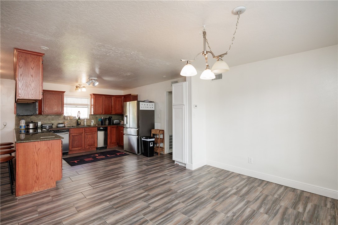 4029 Congressional Drive Corpus Christi, TX 78413 - Photo 5 of 34 a view of a kitchen with stove and wooden floor