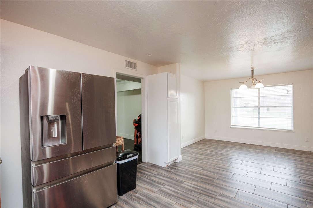 4029 Congressional Drive Corpus Christi, TX 78413 - Photo 10 of 34 a metallic refrigerator freezer sitting in a kitchen