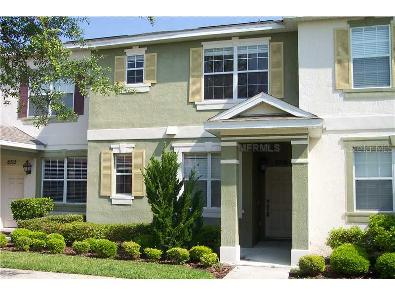 8708 Danforth Drive Windermere, FL 34786 - Photo 1 of 1 a front view of a house with a yard and potted plants