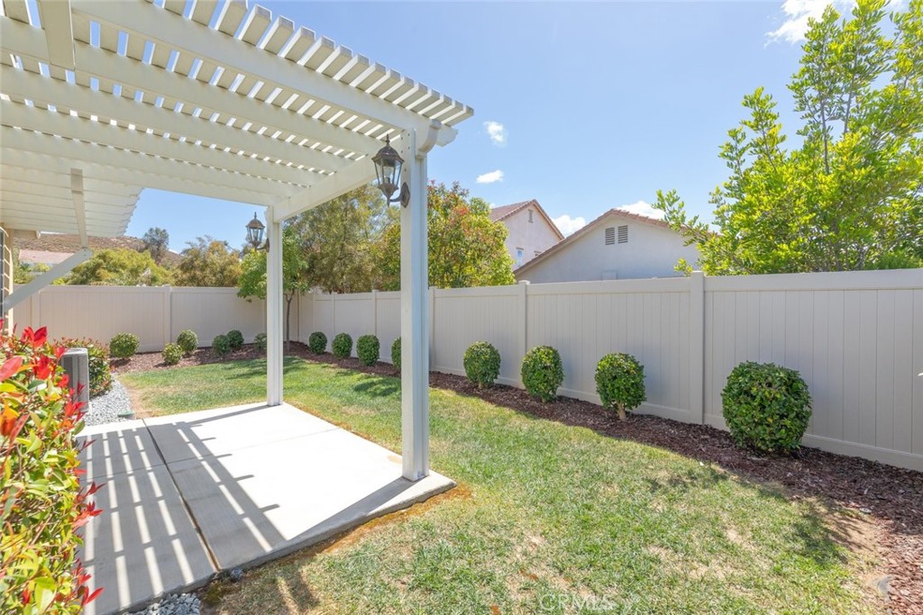 38121 Summer Ridge Drive Murrieta, CA 92563 - Photo 23 of 30 Beautiful Landscaped Backyard with a Lattice Patio Cover.