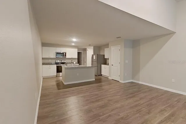 a view of kitchen with wooden floor