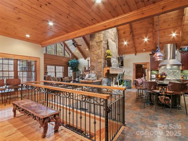 a view of a chairs and table in the balcony