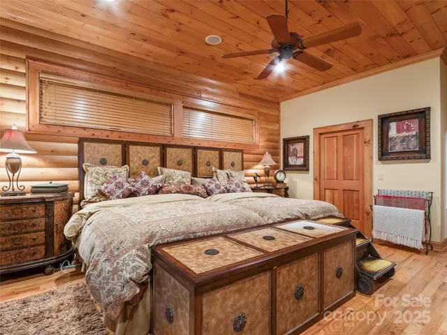 a bed room with a bed and a tv