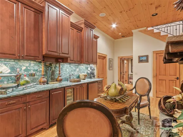 a kitchen with stainless steel appliances granite countertop a sink and cabinets