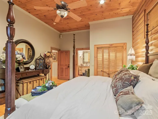 a bedroom with a bed a mirror and desk