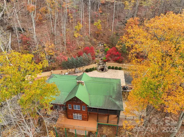 a green field with lots of tress in the background