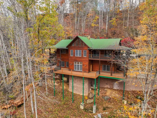 a balcony with table and chairs
