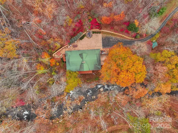 a backyard of a house with a tree