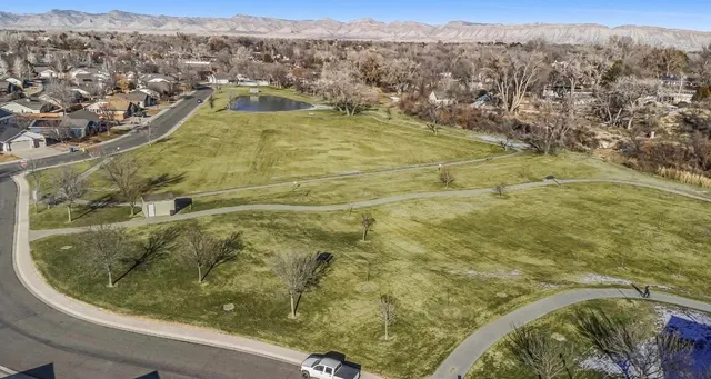 an aerial view of residential houses with outdoor space