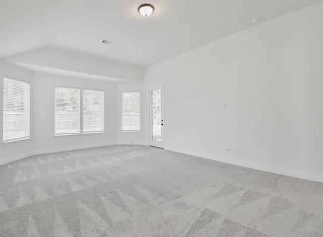 an empty room with windows