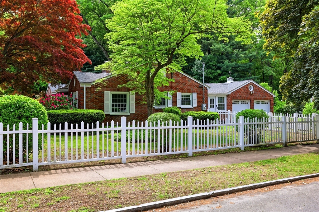 130 Connecticut Avenue Springfield, MA 01107 - Photo 3 of 40 a front view of a house with a garden and fence