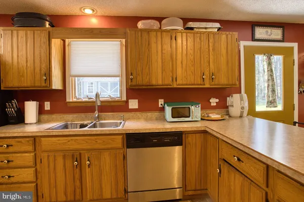 a kitchen with a stove and a microwave