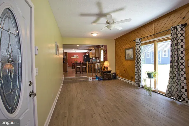 a bathroom with a toilet a sink and a window