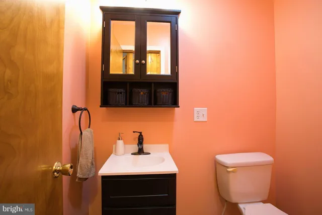 a bedroom with bed and a large mirror