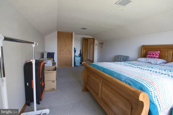 view of a bathroom with a glass door and shower