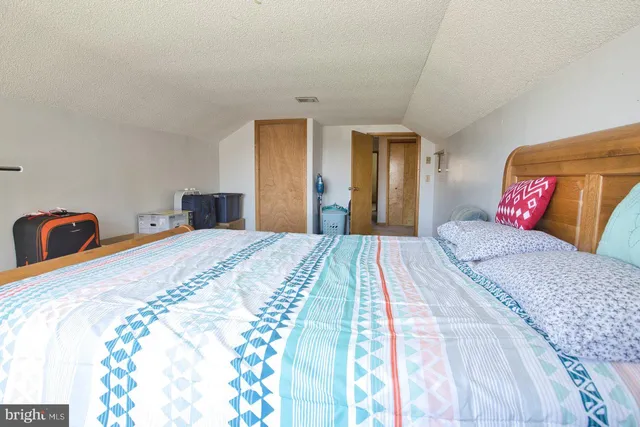 a view of an empty room with a fireplace