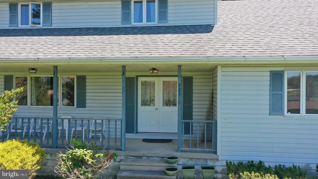 a view of a porch with wooden floor and outdoor space