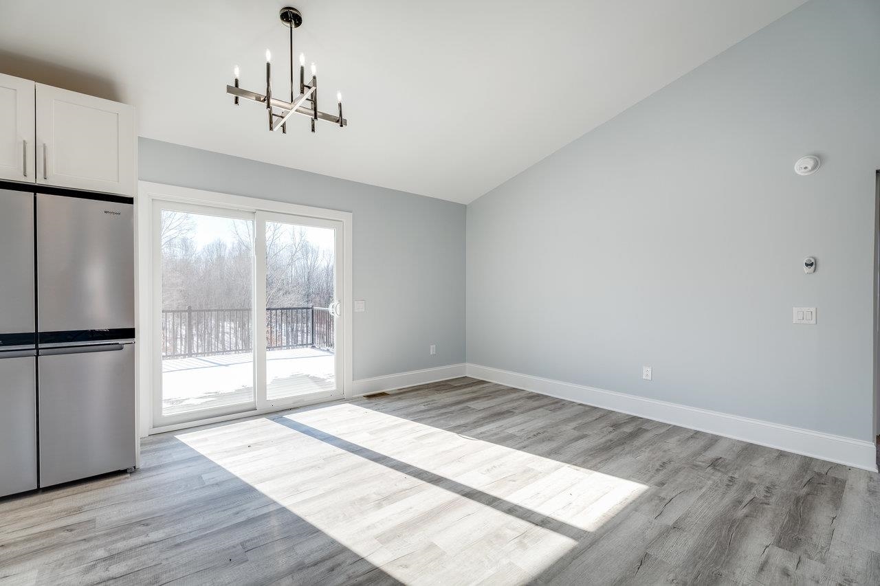 347 Enterprise Road Churchville, VA 24421 - Photo 15 of 75 a view of an empty room with wooden floor and a window