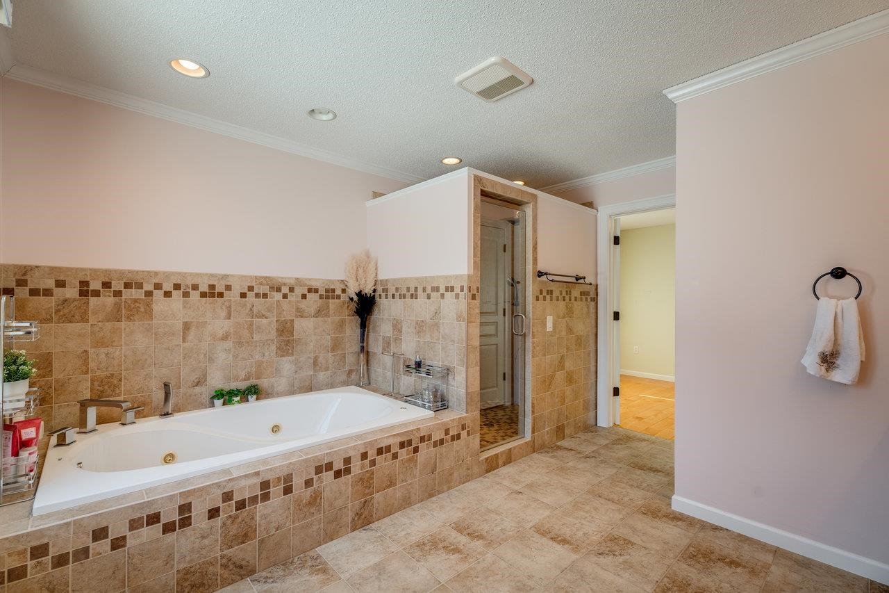 347 Enterprise Road Churchville, VA 24421 - Photo 27 of 75 a bathroom with a tub a sink and a shower