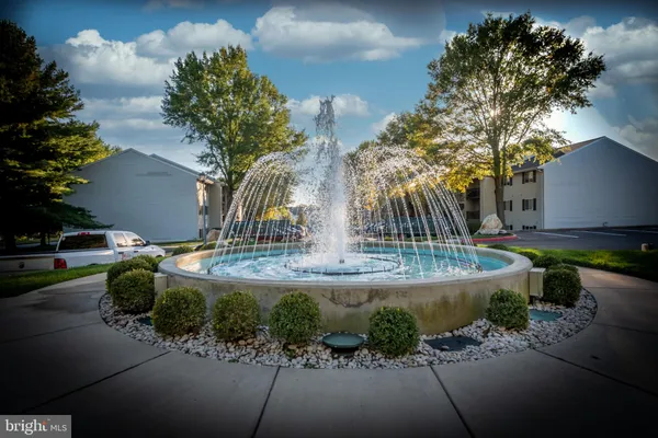 a view of a garden with a fountain