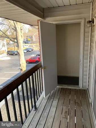 a view of a balcony with wooden floor