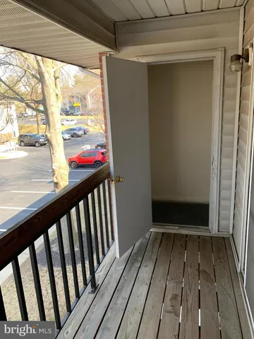 a view of a balcony with wooden floor