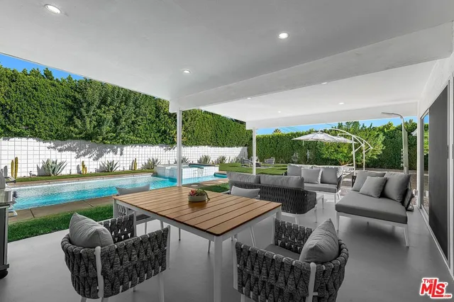 a outdoor living space with furniture and garden view