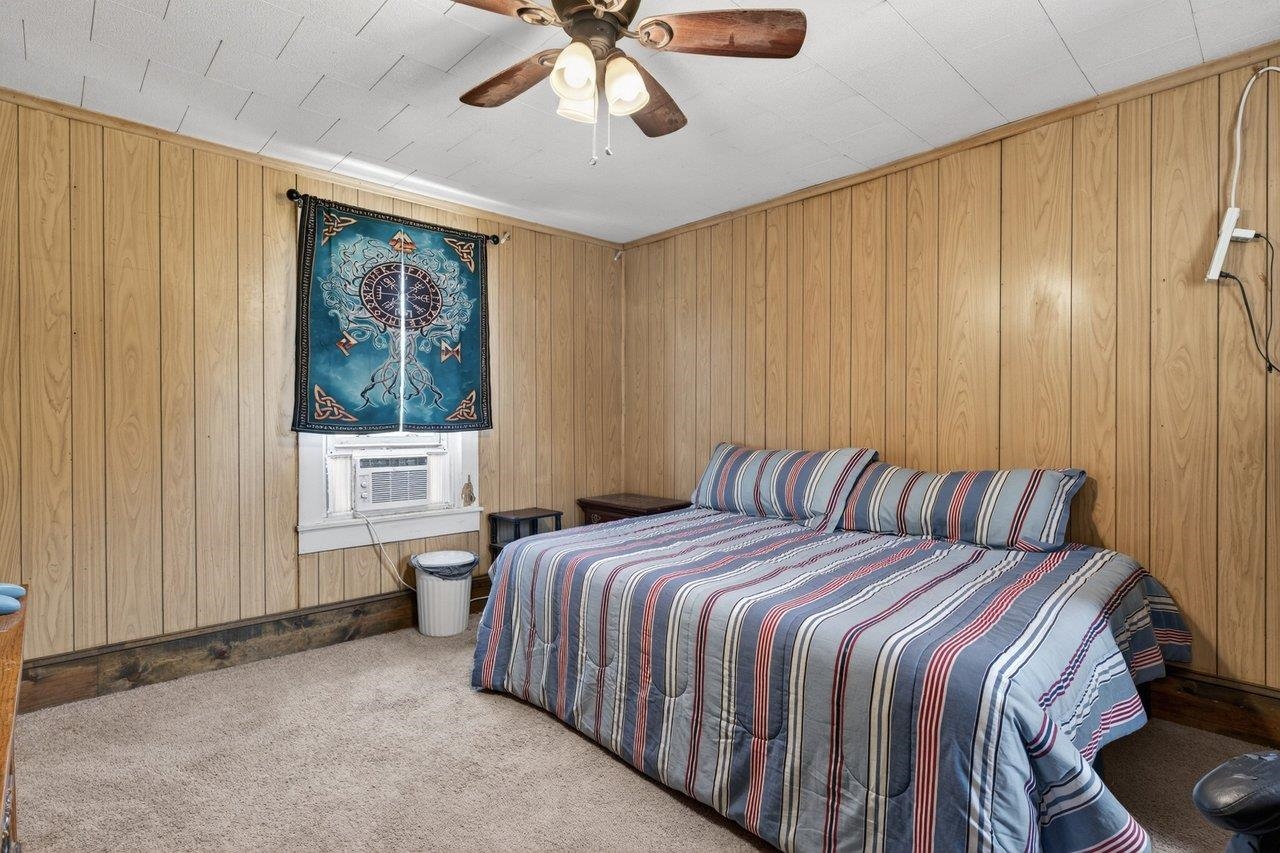 724 Newtown Road Elkton, VA 22827 - Photo 24 of 38 a bedroom with a large bed and a window