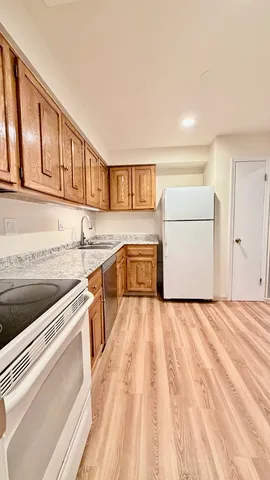 a view of a kitchen with a sink