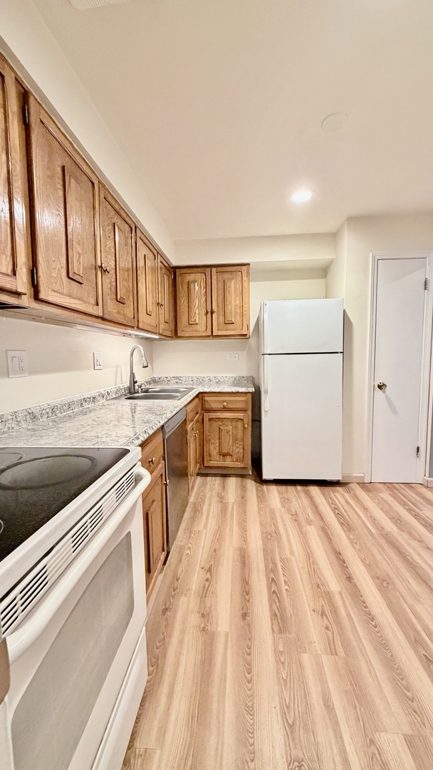 706 East Algonquin Road, Unit 204 Arlington Heights, IL 60005 - Photo 8 of 15 a view of a kitchen with a sink