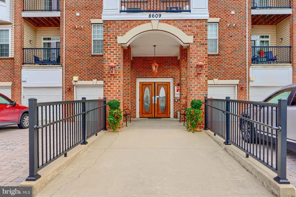 a view of a brick house with large windows