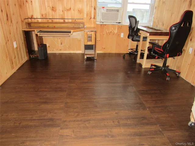 a view of a kitchen with a sink and cabinets