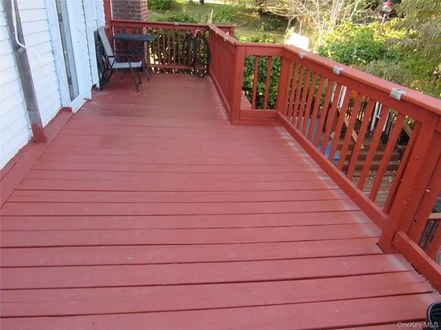 a balcony with wooden floor