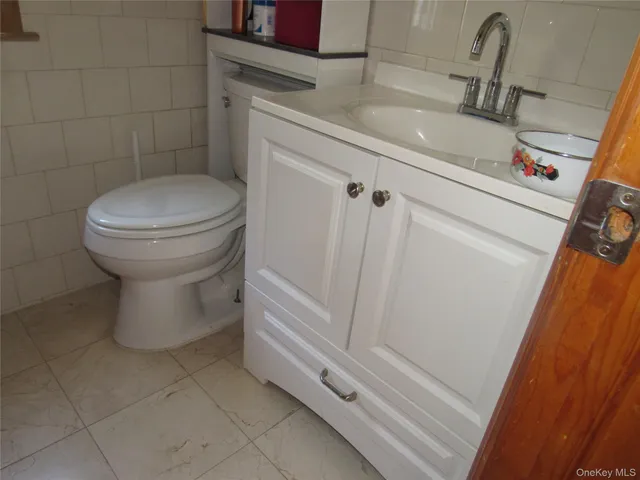 a bathroom with a sink and toilet