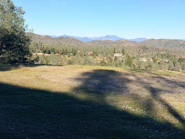 a view of a lake with mountains in the background
