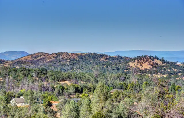 a view of a town with mountains in the background