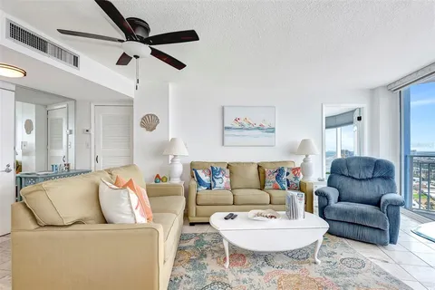 a living room with furniture and a rug