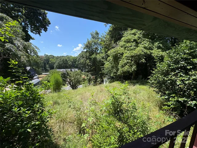 a big yard with lots of green space and deers