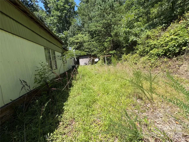 a backyard of a house with lots of green space