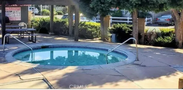 a view of a backyard with sitting area
