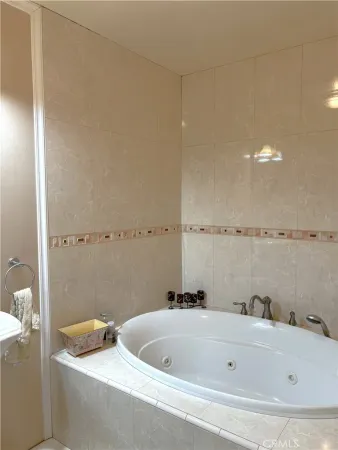 a bathroom with a tub and a sink