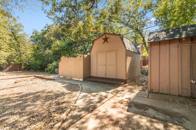 a view of a backyard of the house