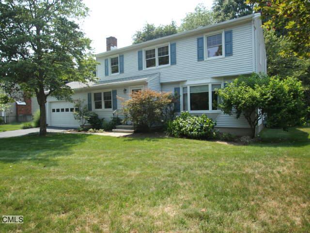50 Hunter Road Fairfield, CT 06824 - Photo 1 of 1 a front view of a house with garden