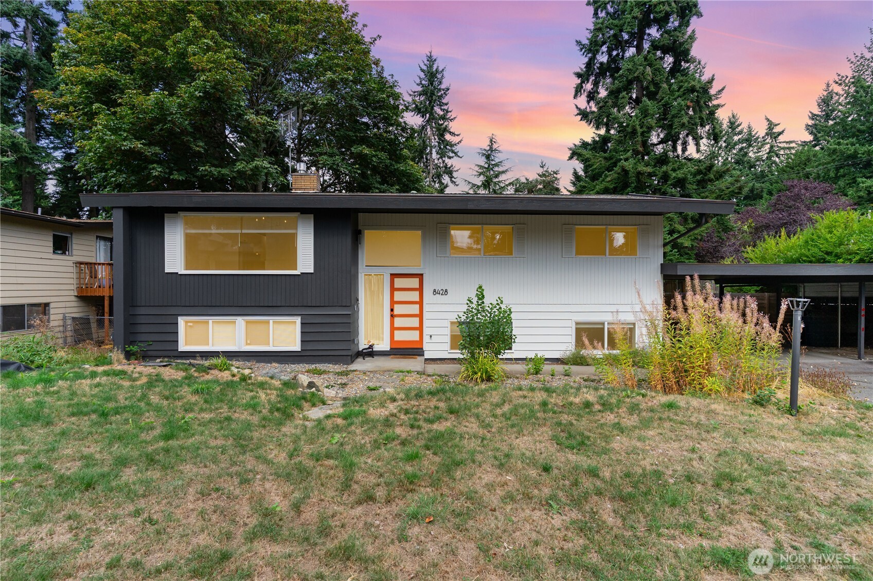 8428 Northeast 132nd Place Kirkland, WA 98034 - Photo 1 of 30 a front view of house with yard and trees in the background