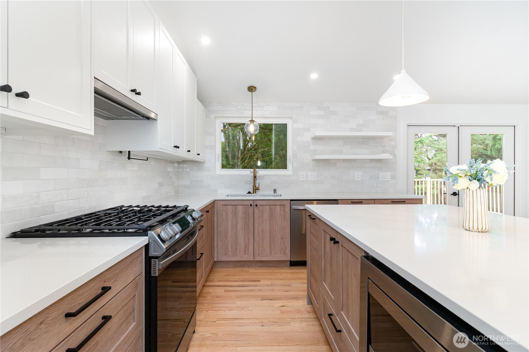 8428 Northeast 132nd Place Kirkland, WA 98034 - Photo 11 of 30 a kitchen with stainless steel appliances a sink stove and cabinets