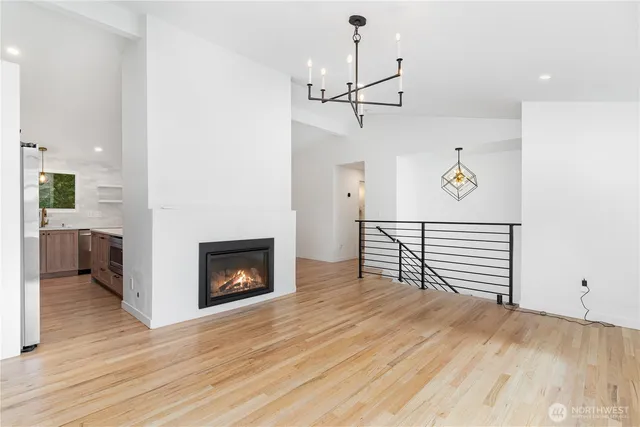 a view of an empty room and fire place