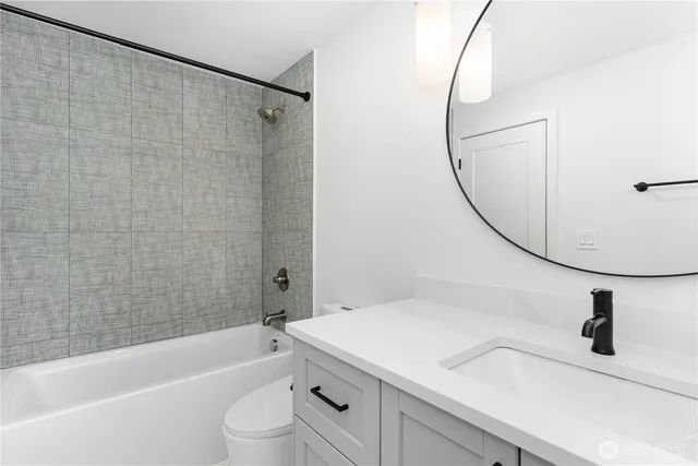 a bathroom with a sink a toilet and a bathtub