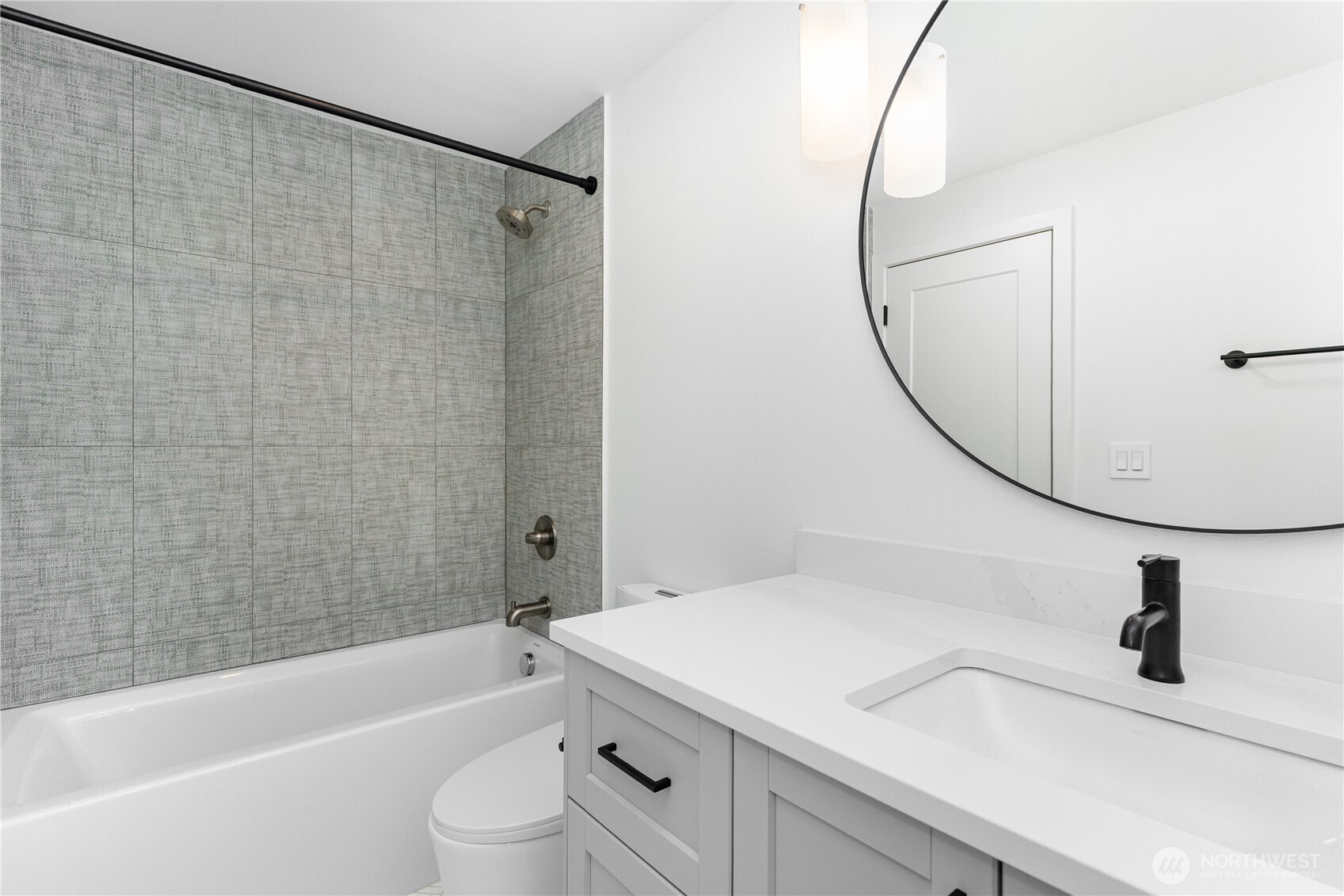 8428 Northeast 132nd Place Kirkland, WA 98034 - Photo 13 of 30 a bathroom with a sink a toilet and a bathtub